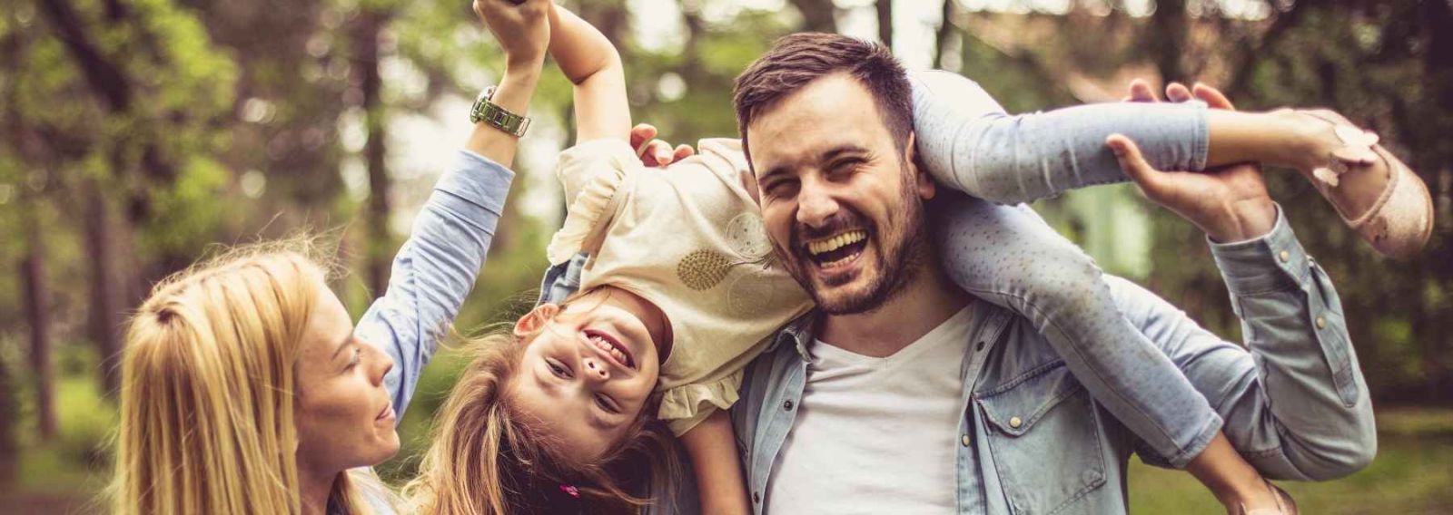 family of three playing